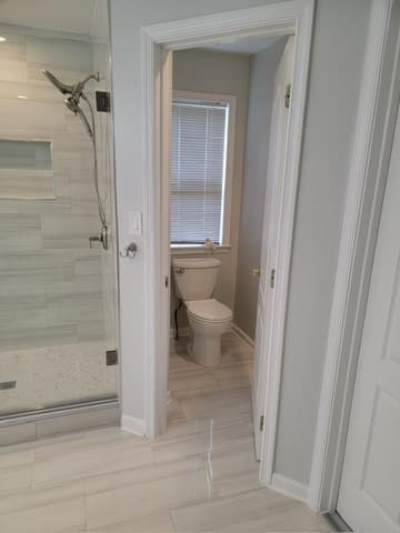 Updated bathroom with new toilet and tile Northern Virginia
