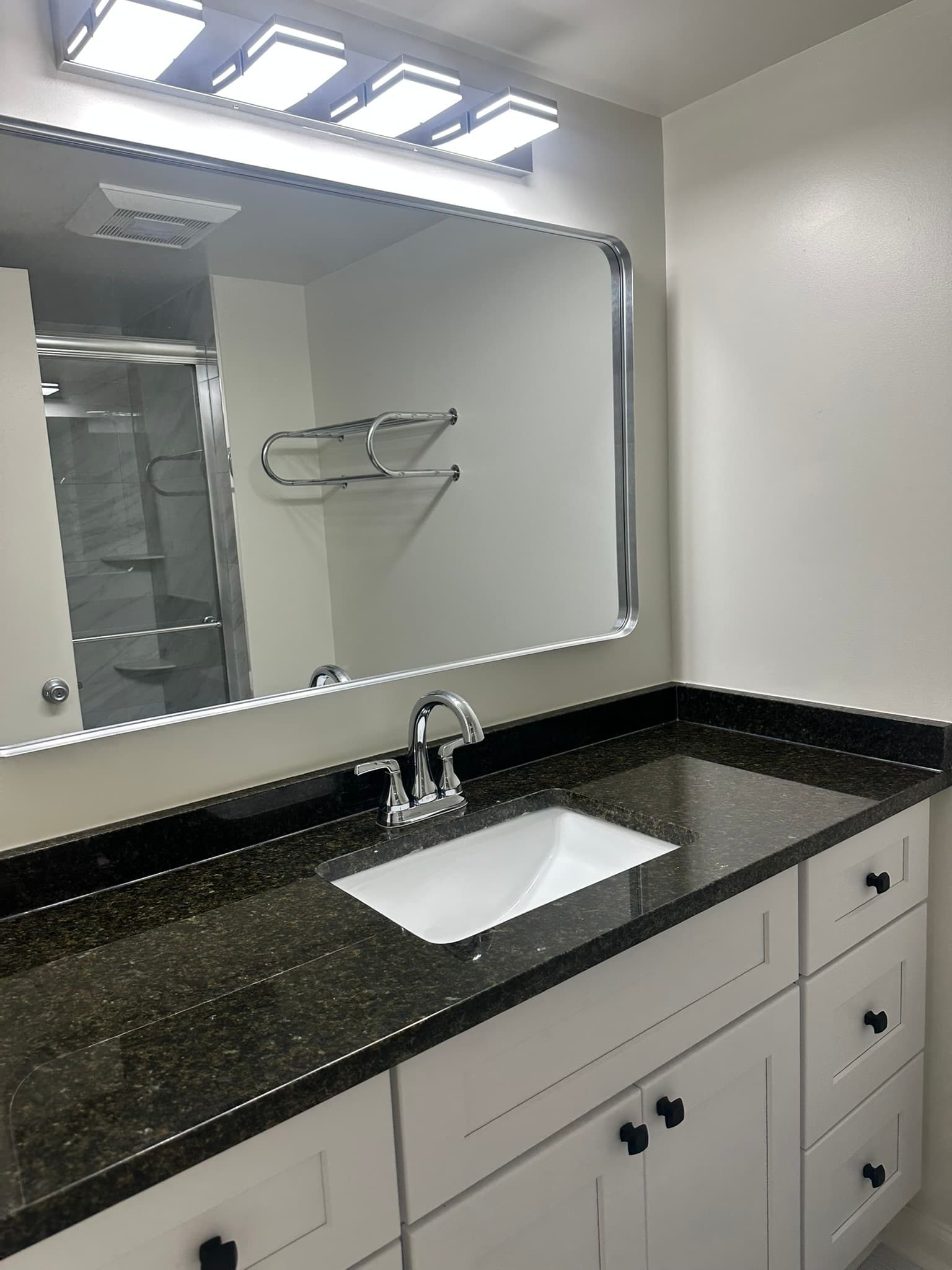 Vanity detail with custom countertop and fixtures