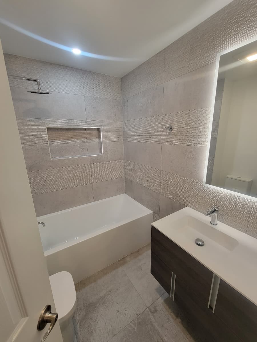 Master bath with tub and tile work by Ventura