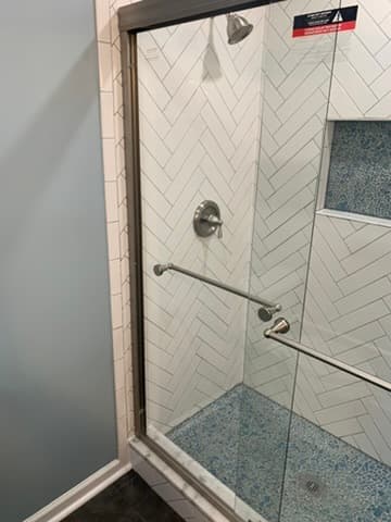 Custom shower with designer tile by Ventura