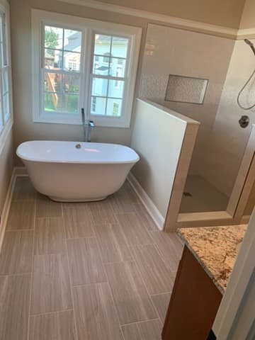 Freestanding bathtub with designer fixtures