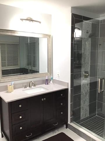 Custom vanity installation with quartz countertop
