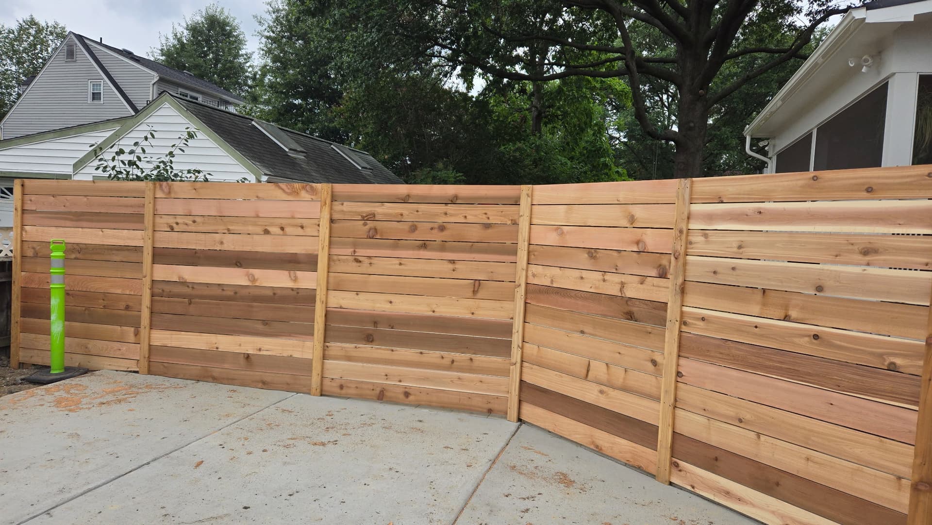 Cedar horizontal privacy fence curved layout by Ventura Home Improvement