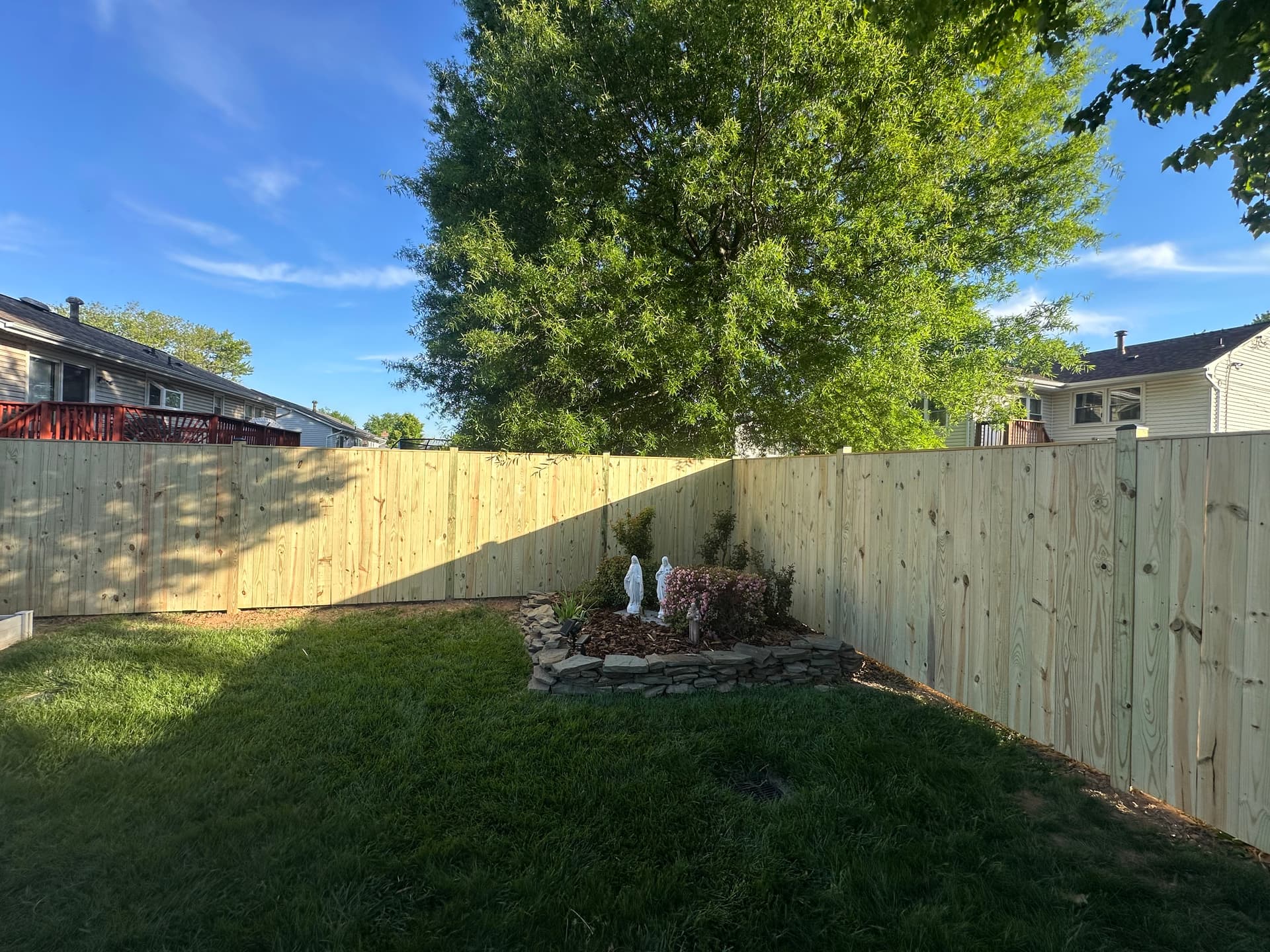 Completed wood fence installation by Ventura Home Improvement