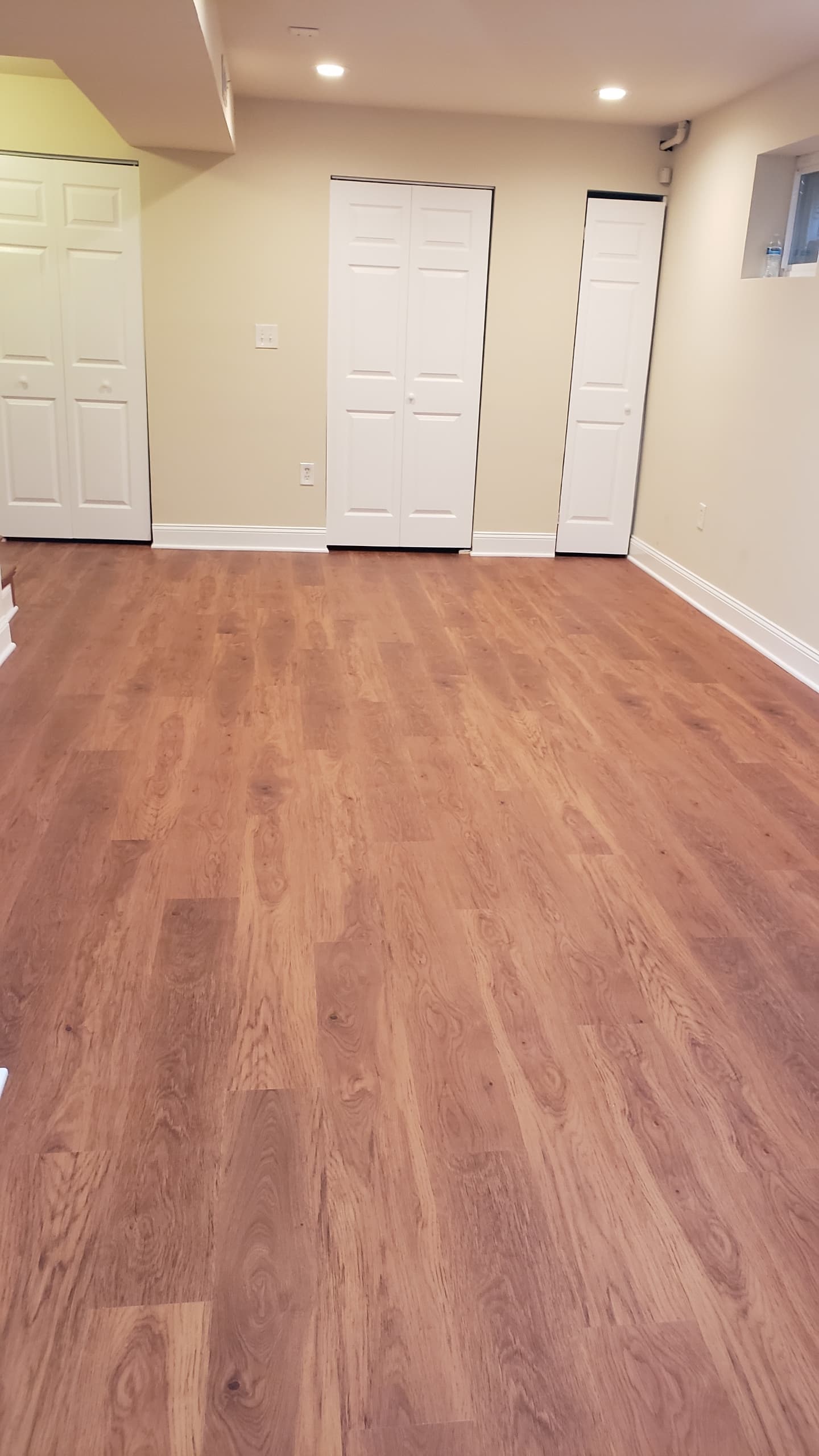 Warm LVP flooring installation in basement Northern Virginia