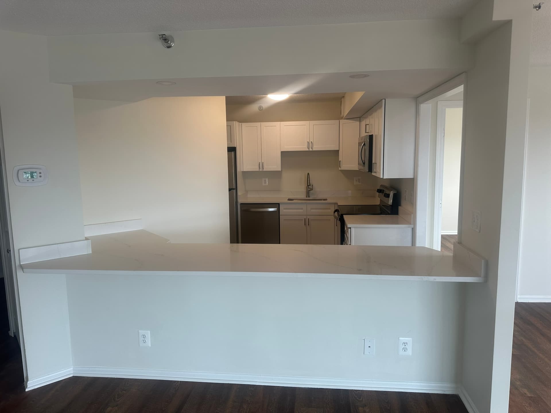 White kitchen renovation with shaker cabinets