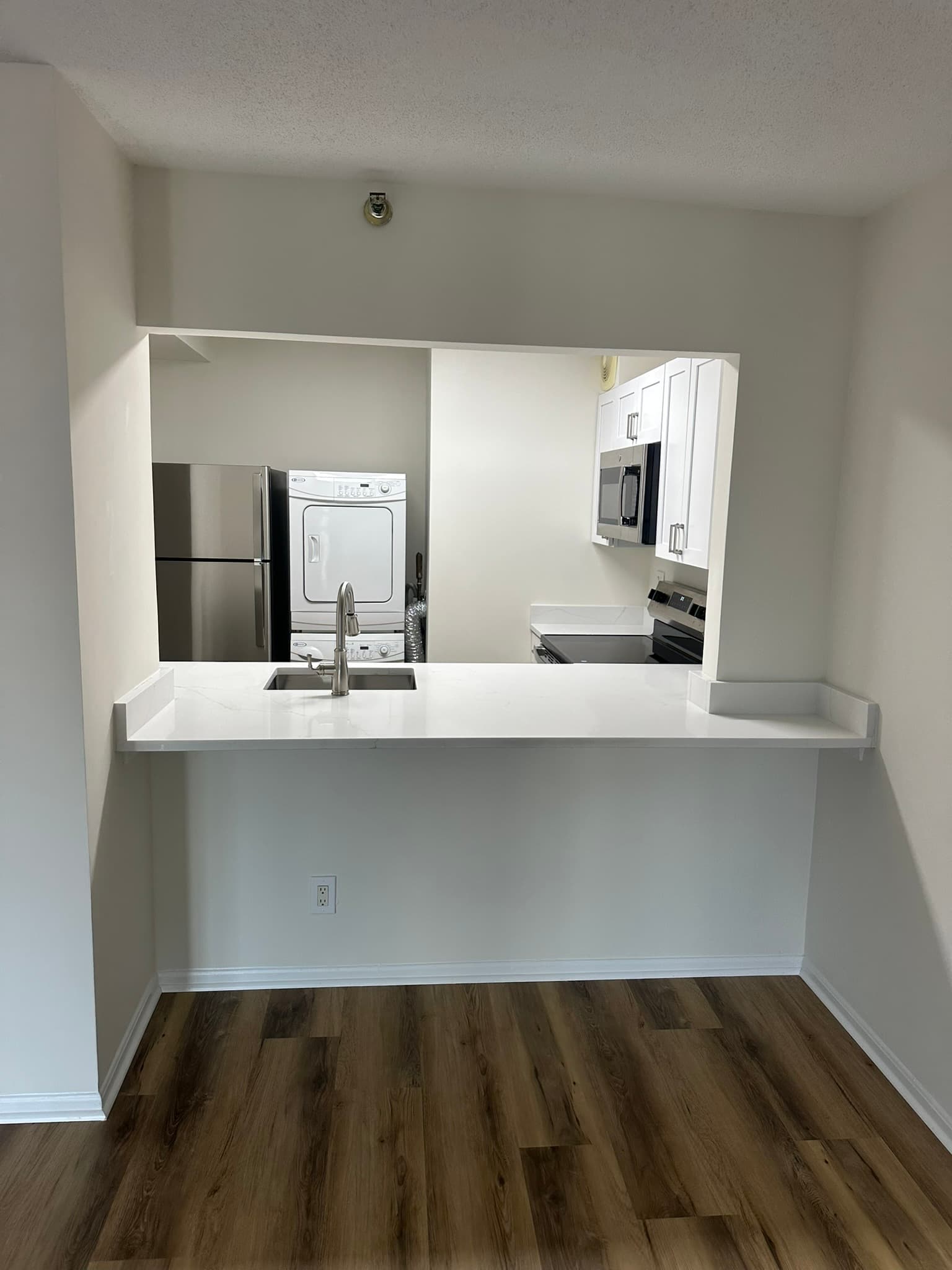 Full kitchen renovation with custom white cabinets