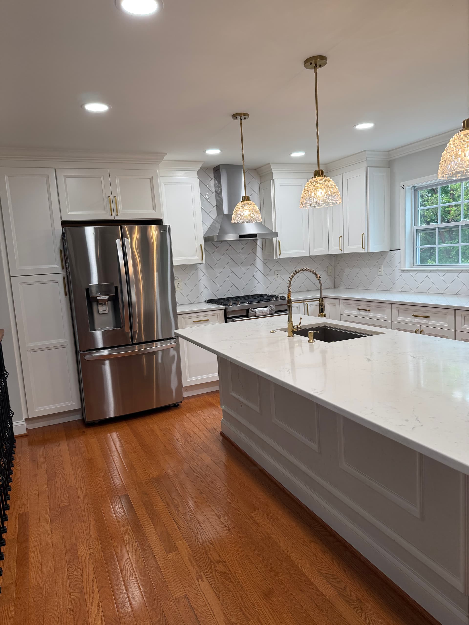Kitchen renovation with custom cabinetry and stone countertops