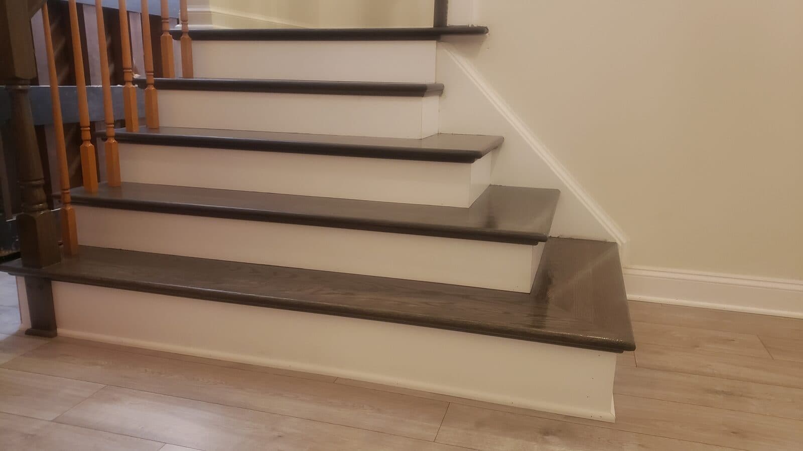 Staircase renovation with dark stain finish by Ventura