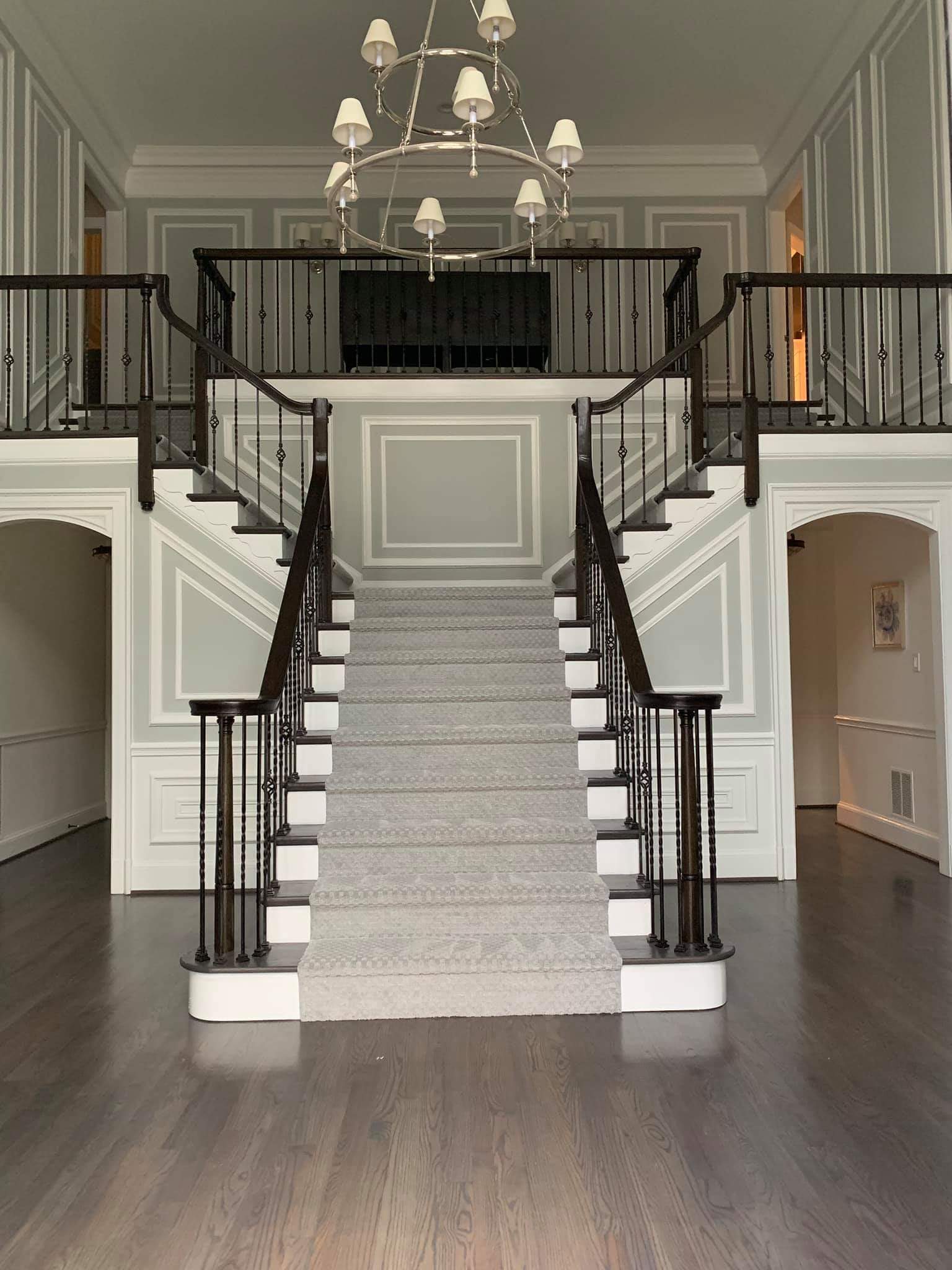 Elegant staircase with custom railing and hardwood treads