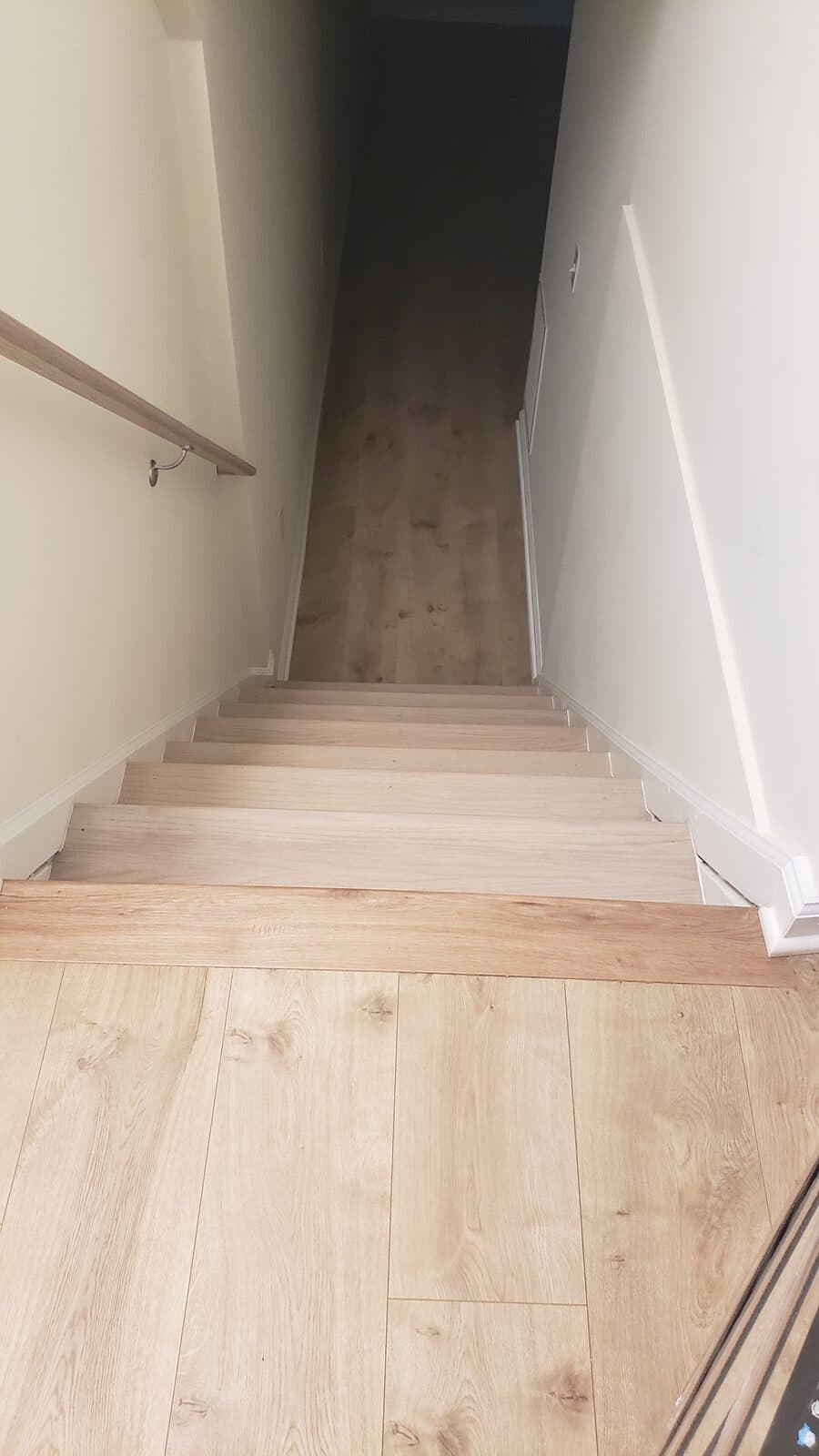 Light stain staircase with iron balusters Northern Virginia