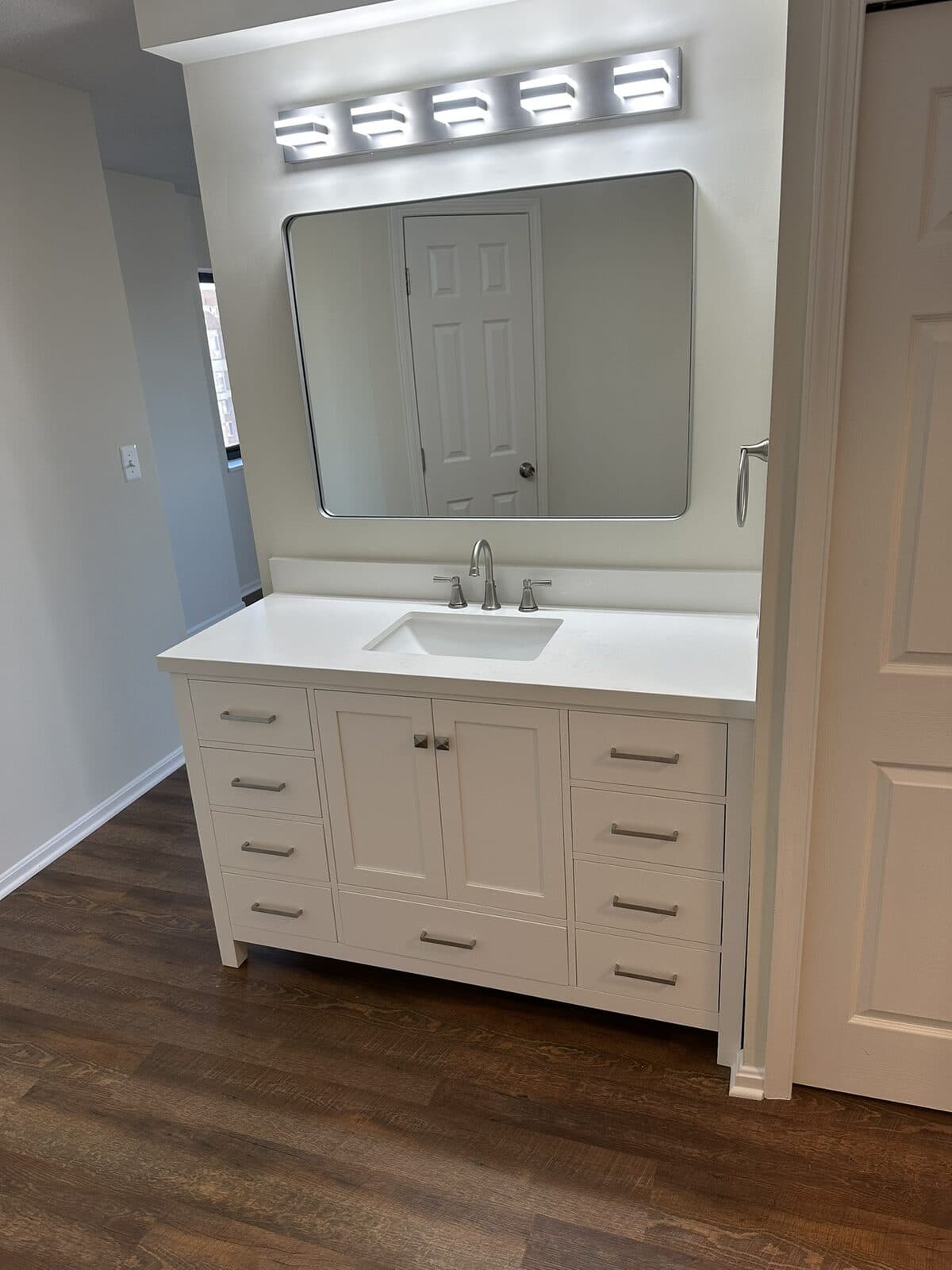 White vanity countertop installation by Ventura Home Improvement