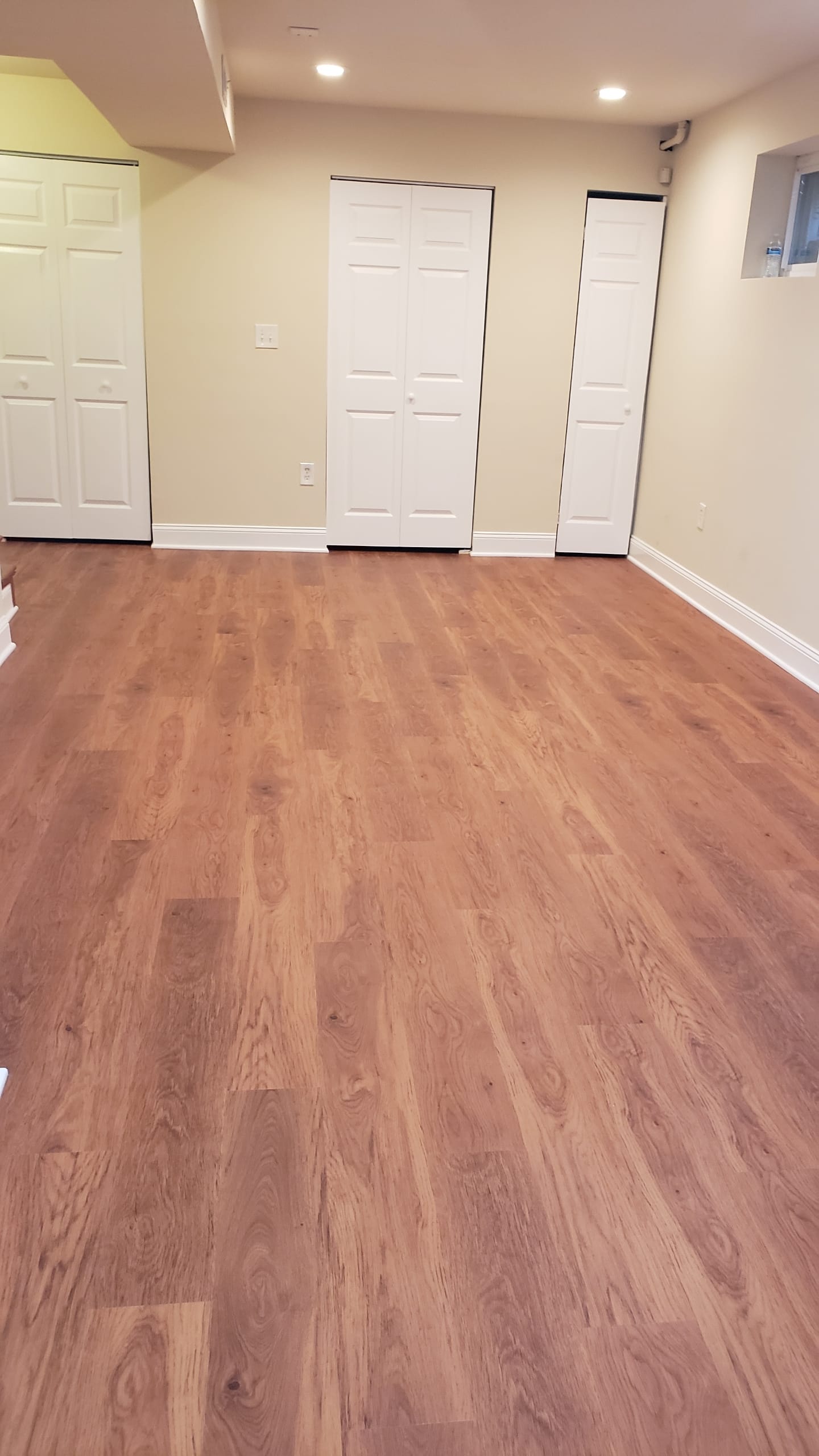 Warm LVP flooring installation in basement Northern Virginia