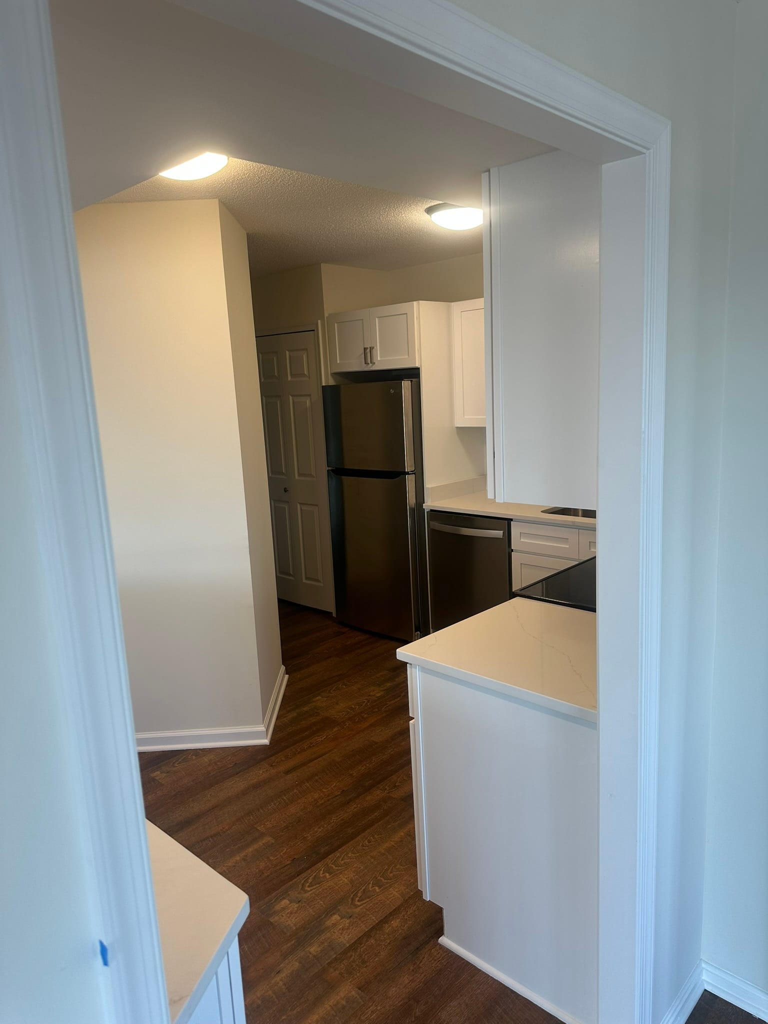 Full kitchen view with custom cabinets and backsplash