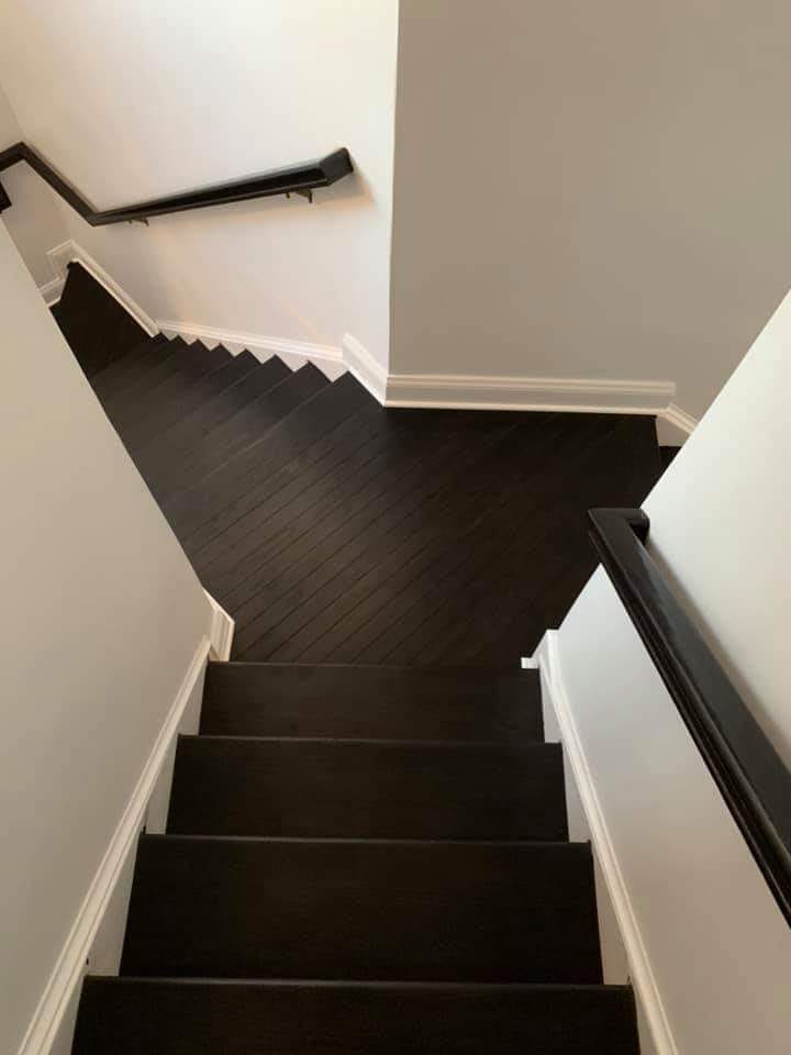 Dark hardwood staircase renovation by Ventura Home Improvement Northern Virginia