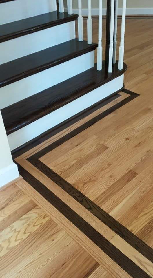 Custom dark wood staircase with iron balusters Northern Virginia