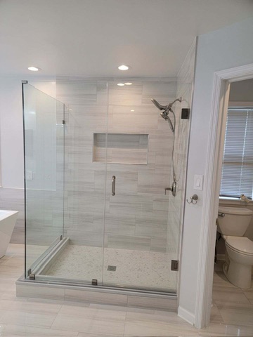 Custom tile walk-in shower with frameless glass