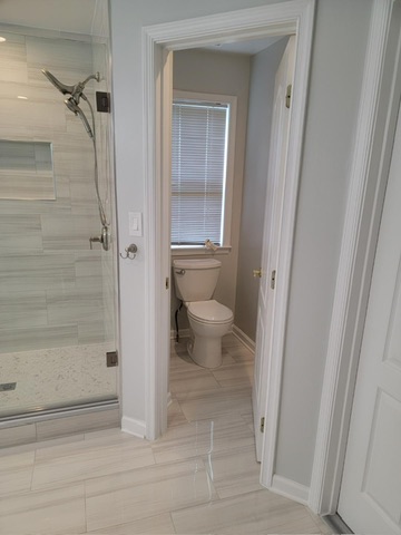 Updated bathroom with new toilet and tile Northern Virginia