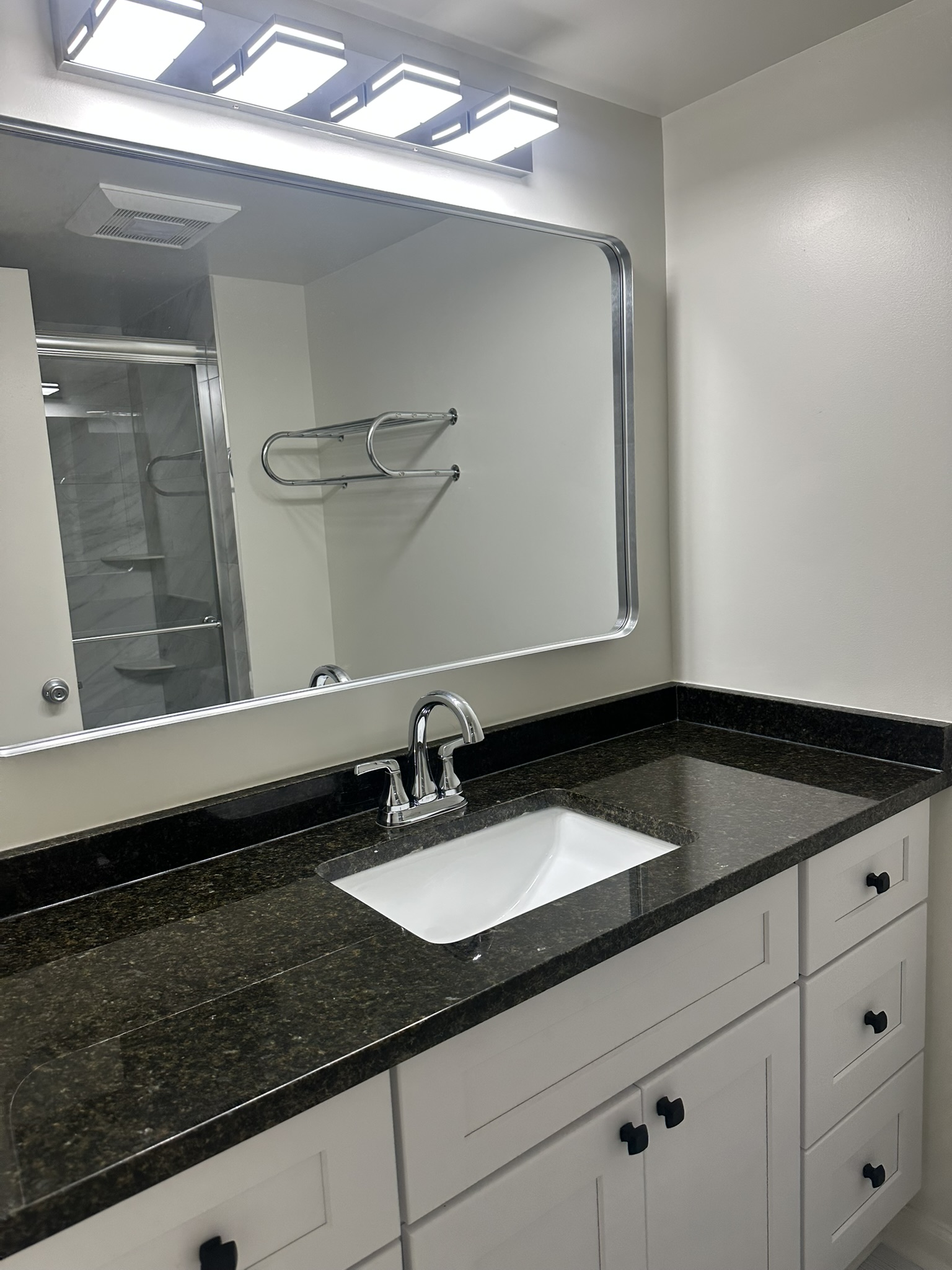 Vanity detail with custom countertop and fixtures