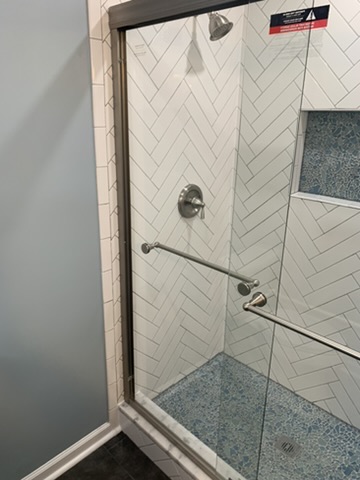 Custom shower with designer tile by Ventura