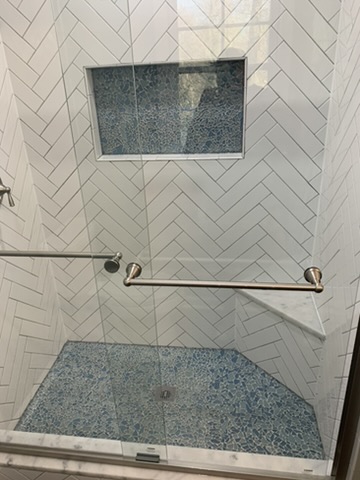 Tile shower with custom niche by Ventura Home Improvement