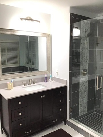 Custom vanity installation with quartz countertop