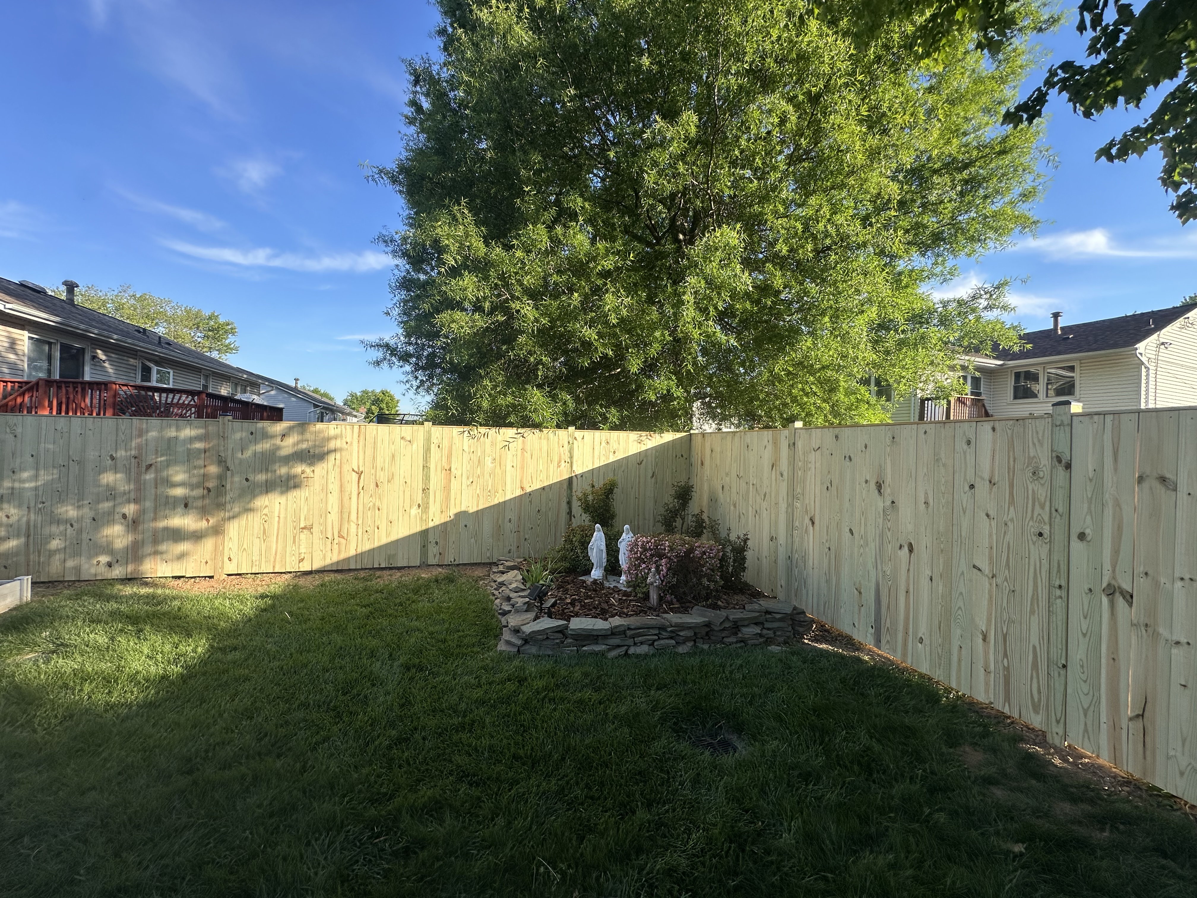 Completed wood fence installation by Ventura Home Improvement