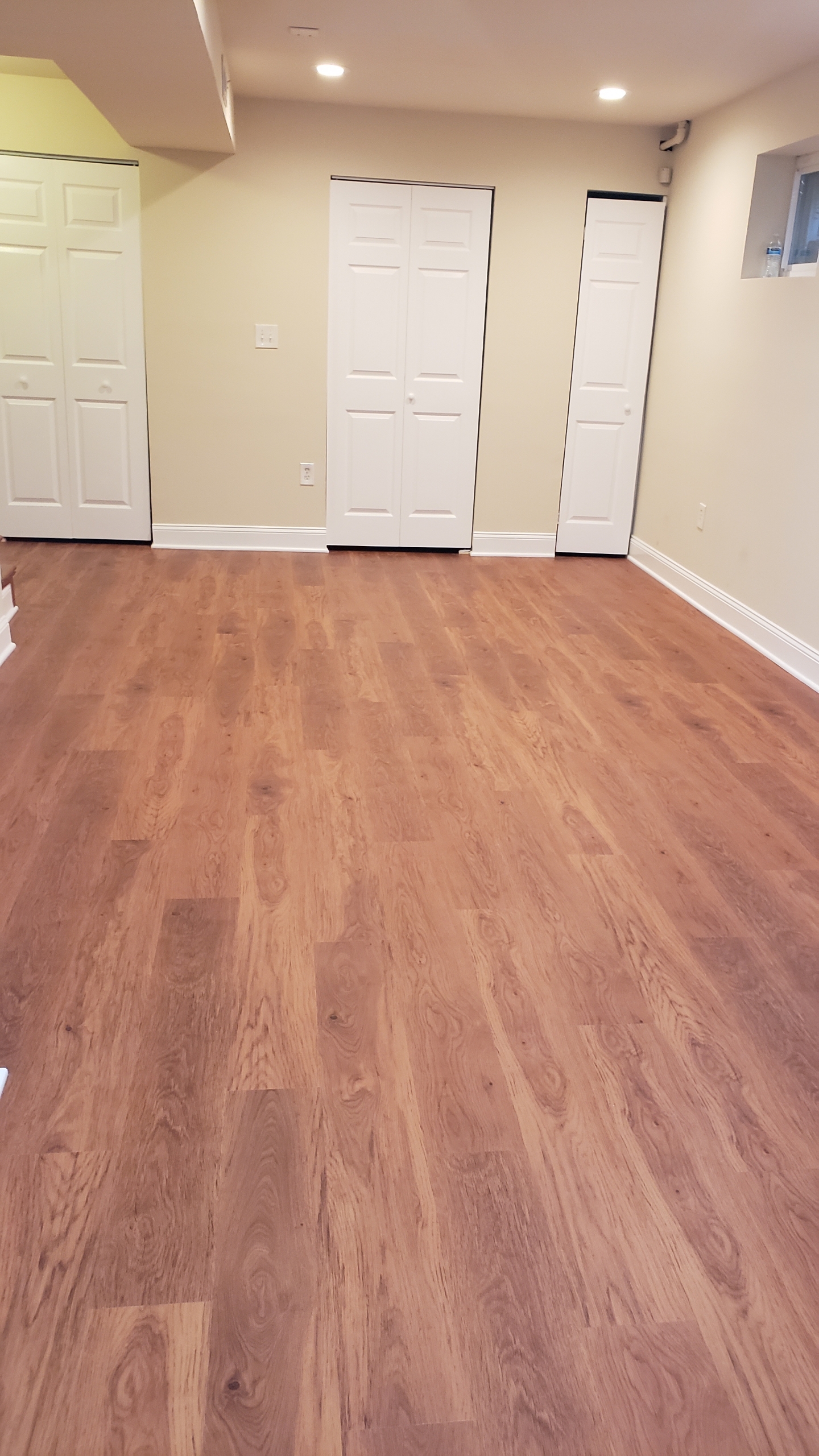 Warm LVP flooring installation in basement Northern Virginia