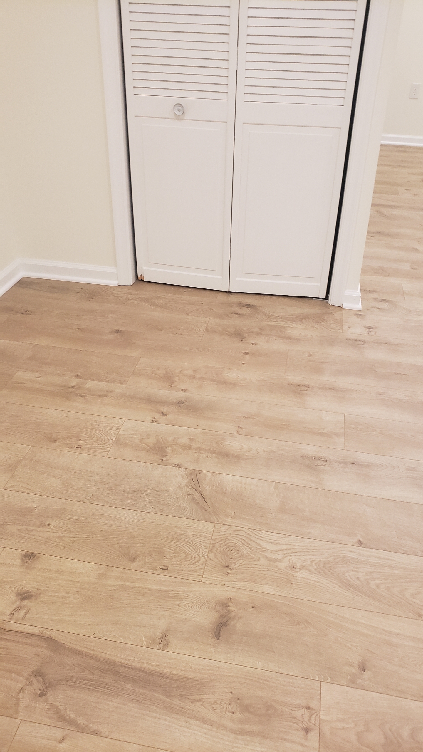 Light oak LVP flooring bedroom installation Northern Virginia