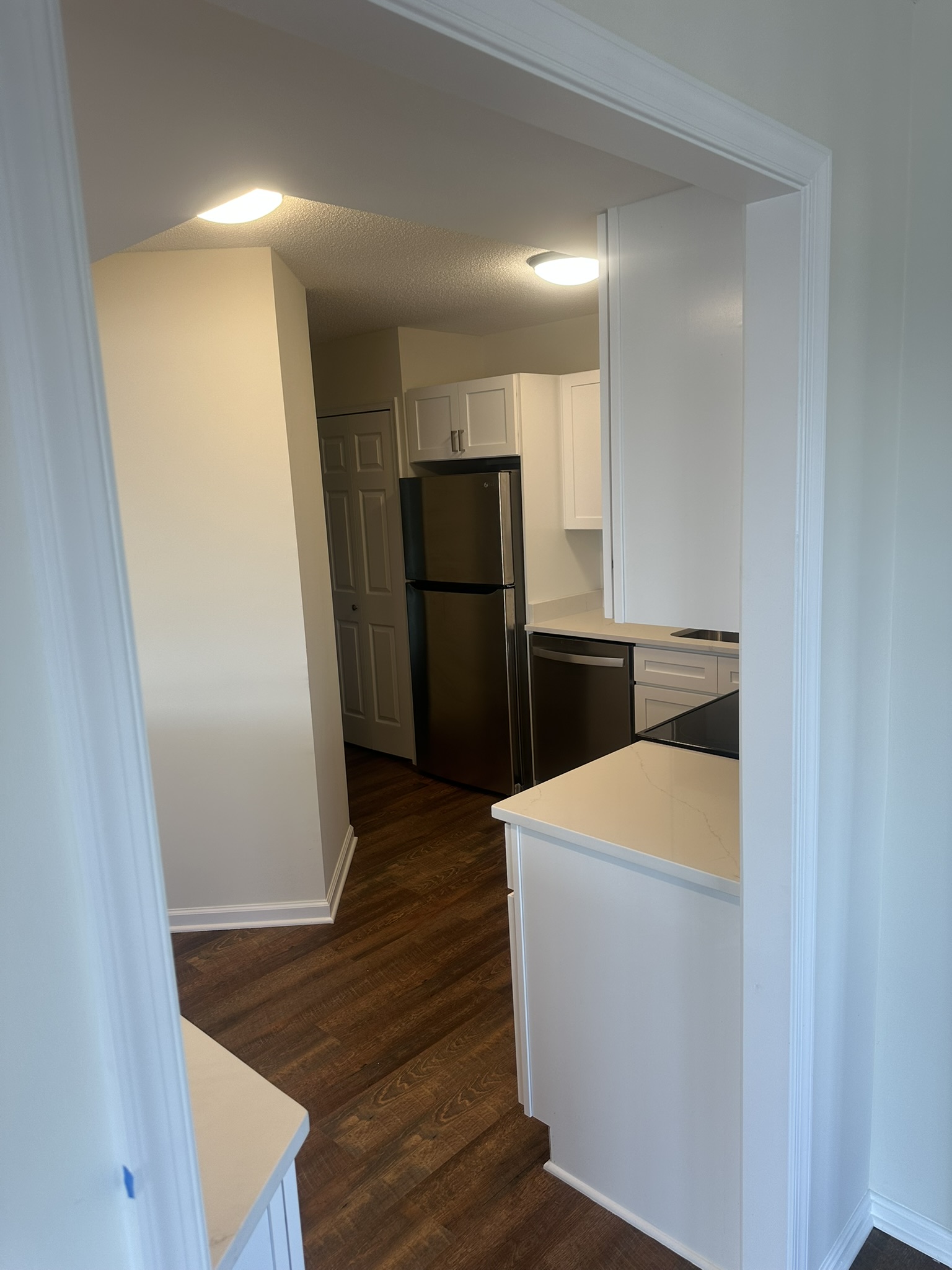 Full kitchen view with custom cabinets and backsplash