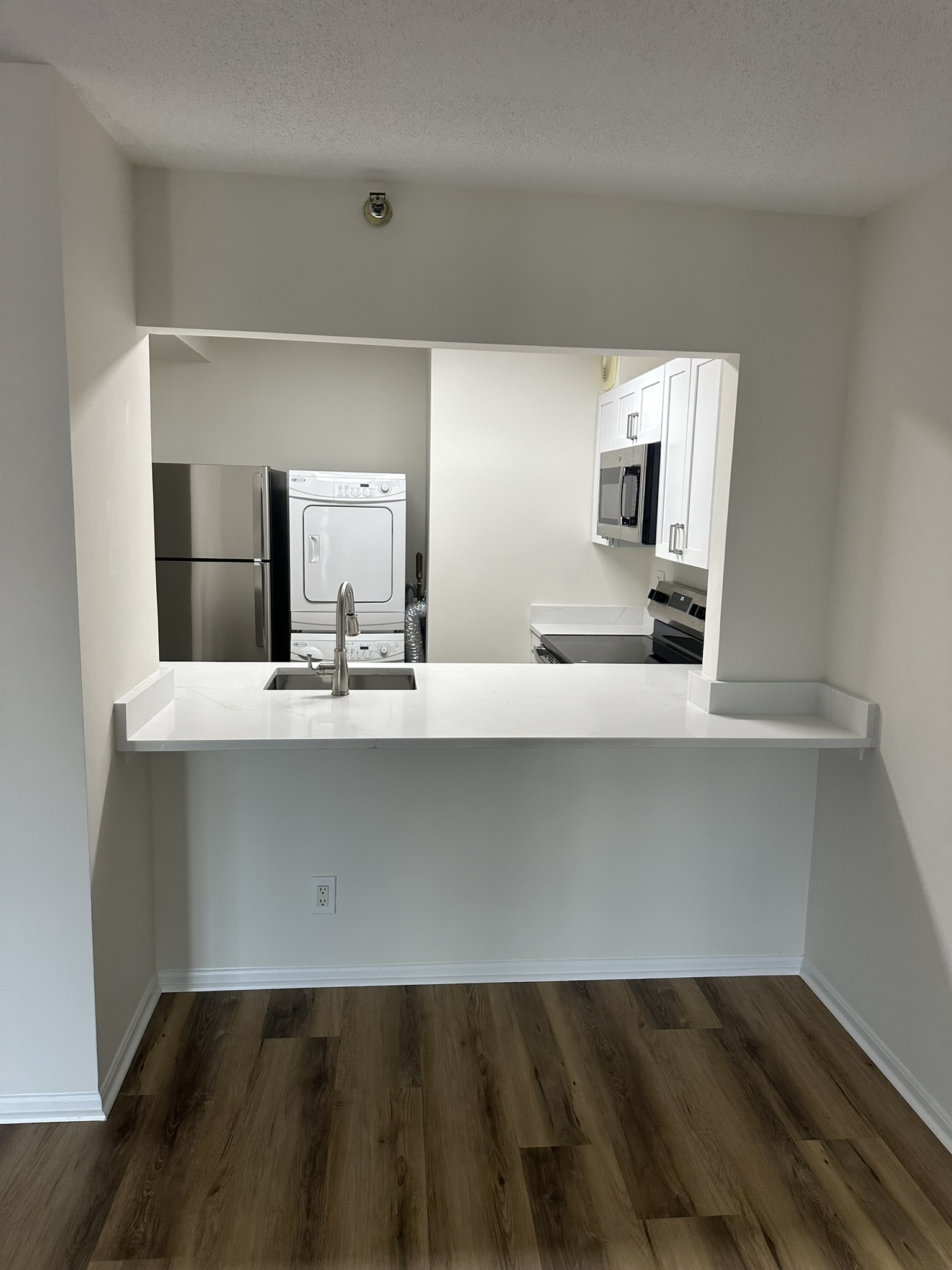 Full kitchen renovation with custom white cabinets